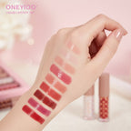 Lip gloss swatches on wrist showing all shades